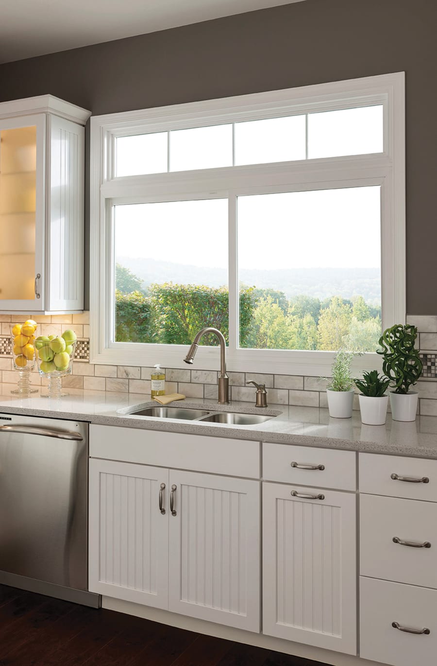 A double slider lift out window over a kitchen sink